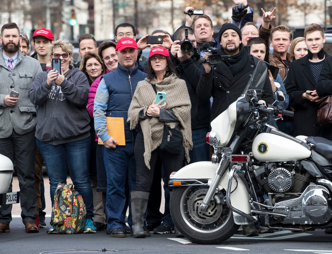  Preparing for the big day at the Capitol, top. Above, tourists outside the new Trump International Hotel. The official inaugural festivities started Thursday afternoon and do not wrap up until Saturday morning. Credit Doug Mills/The New York Times 